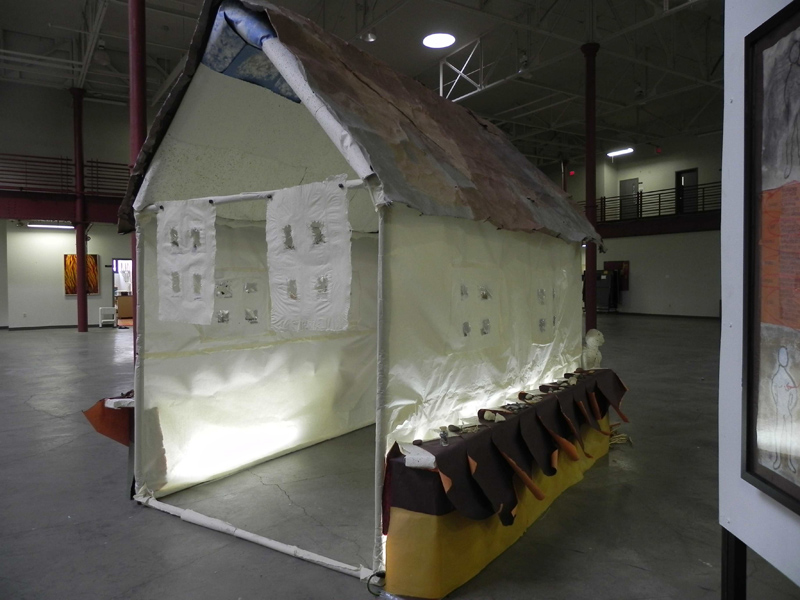 Healing House on view at Grain Belt Brewery Bottling House during
2014 Art-A-Whirl<br>Natural elements were embedded into the paper like seeds and shells and the windows contain  clear envelopes of herbs, each of which is labeled with a key for reference as to its healing properties. Tai Chi and massage where done in the house over the course of the weekend.  